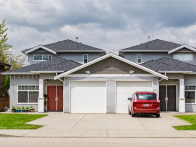 large home with double white garage doors